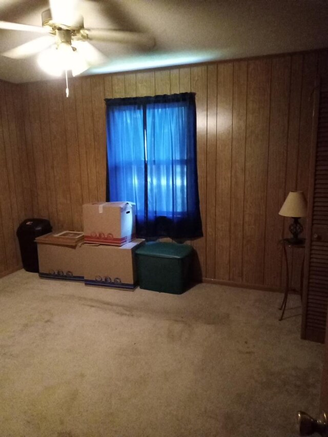 210 Anderson St, Kinston, AL 36453 - bedroom with wooden walls, carpet floors, a closet, ceiling fan, and a textured ceiling