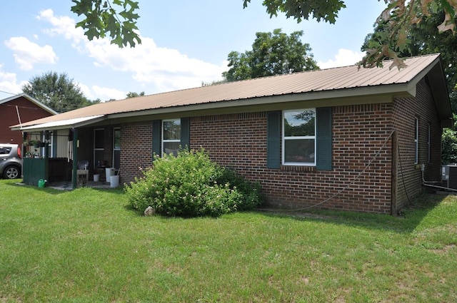 exterior space with a yard