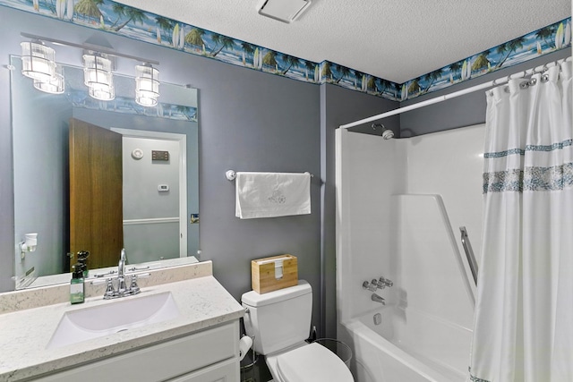 bathroom featuring toilet, shower / bath combination with curtain, a textured ceiling, and vanity