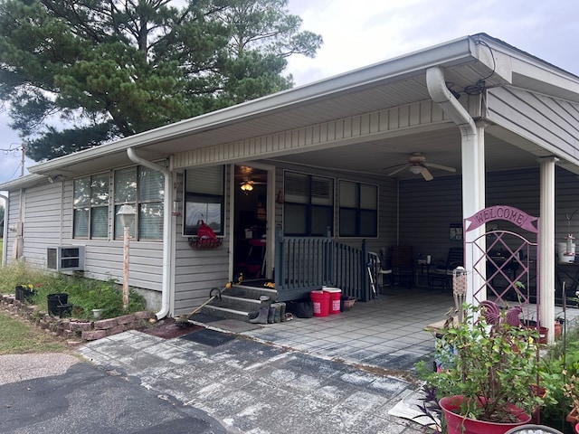 view of front of property with central AC and ceiling fan