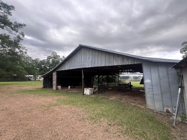 view of side of home featuring a lawn