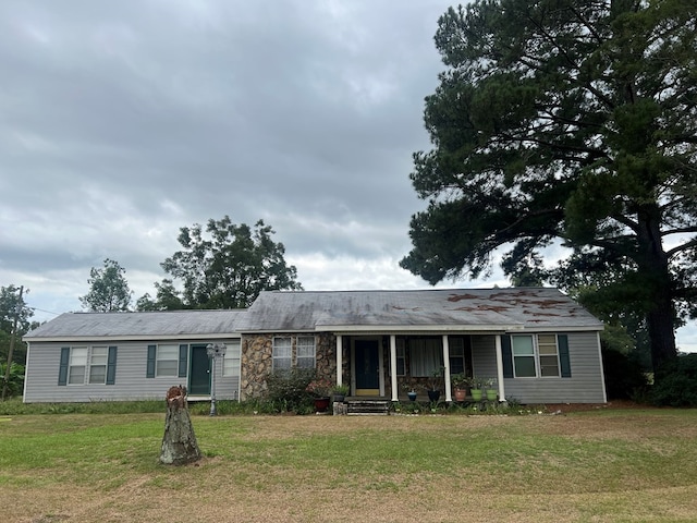 ranch-style home with a front yard