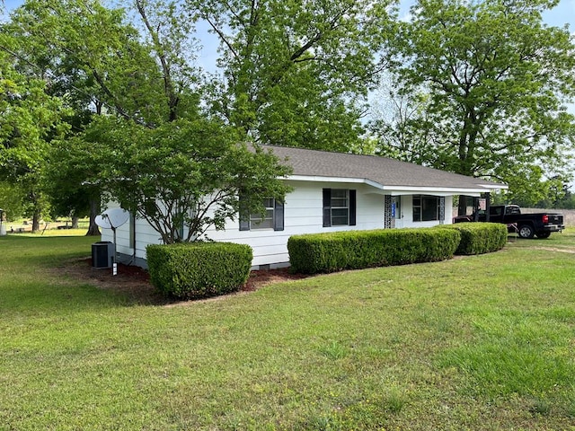 1339 Davis St, Columbia, AL 36319 - view of front facade with a front lawn, central AC unit, and roof with shingles