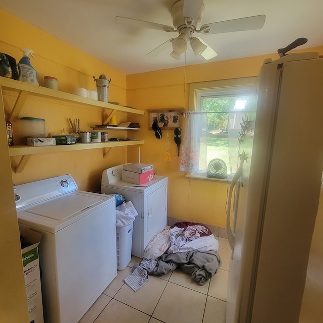 laundry room with washer and dryer, ceiling fan, and light tile patterned flooring