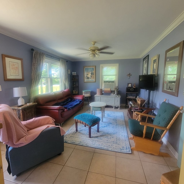 tiled living room with ceiling fan and crown molding