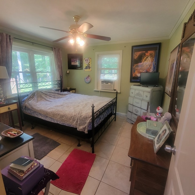 tiled bedroom featuring multiple windows, ceiling fan, and ornamental molding