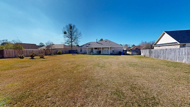 view of yard featuring a fenced backyard