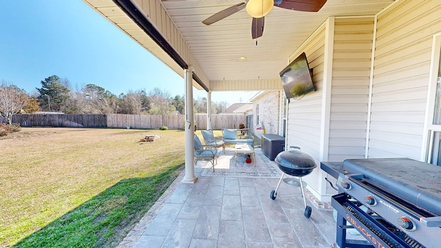 view of patio with a fenced backyard, ceiling fan, and grilling area