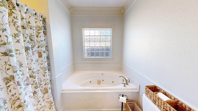 full bath featuring ornamental molding, a jetted tub, and curtained shower