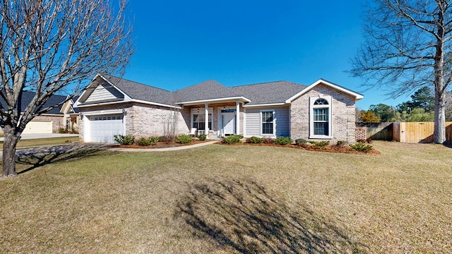 view of front of house featuring a garage, brick siding, fence, and a front lawn