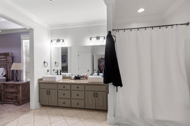 full bathroom with double vanity, a sink, and tile patterned floors