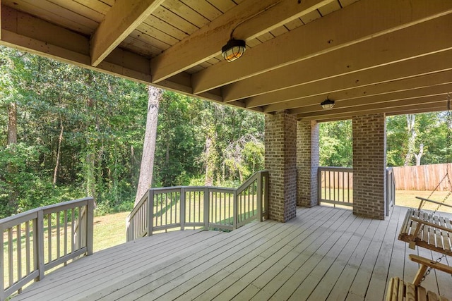 wooden terrace featuring fence