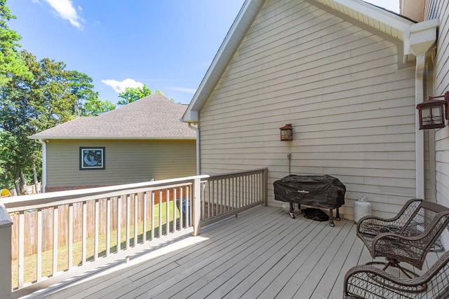 wooden deck featuring area for grilling