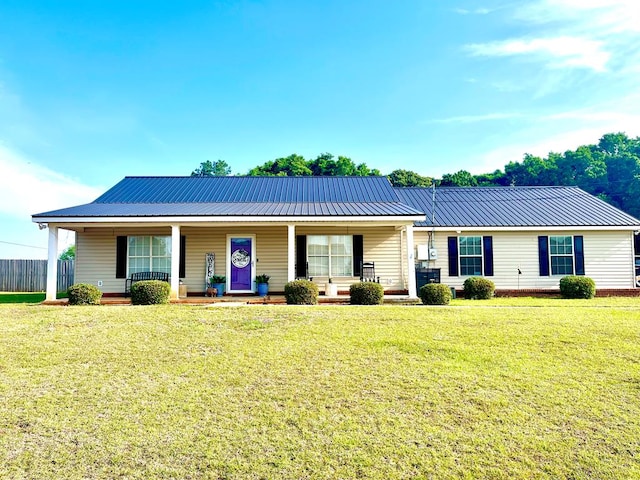 31 County Road 276, Enterprise, AL 36330 - ranch-style house featuring a metal roof, a porch, and a front lawn