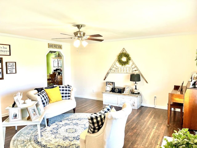 31 County Road 276, Enterprise, AL 36330 - living room featuring a ceiling fan, crown molding, dark wood-style flooring, and arched walkways