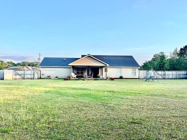 31 County Road 276, Enterprise, AL 36330 - rear view of property with a metal roof and a fenced backyard