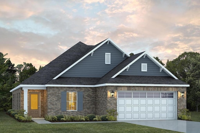 view of front of home featuring a front lawn, concrete driveway, and a garage