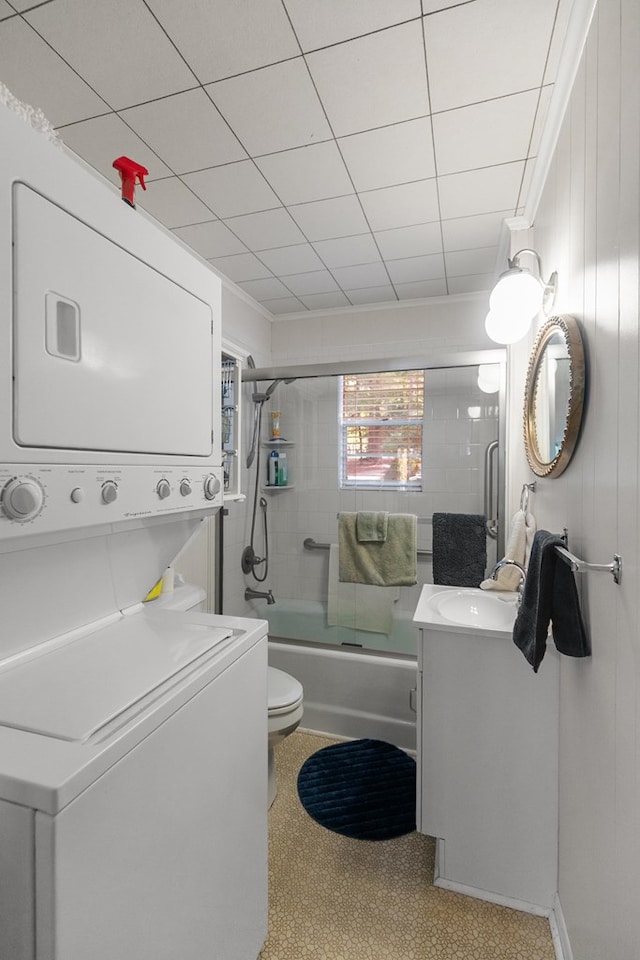 668 Lake Front Dr, Abbeville, AL 36310 - bathroom featuring stacked washing machine and dryer, vanity, and enclosed tub / shower combo