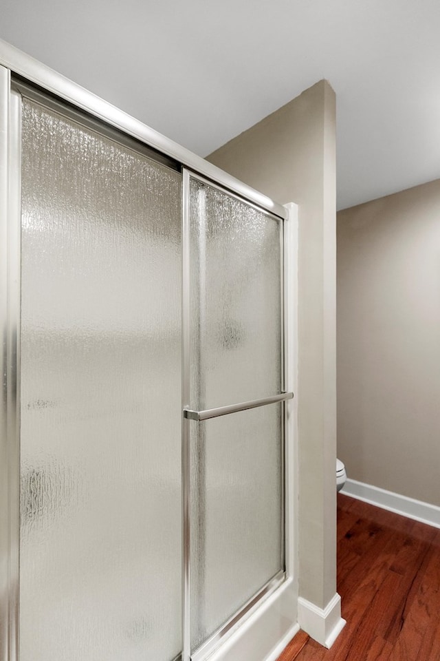 668 Lake Front Dr, Abbeville, AL 36310 - full bathroom with a shower with door and wood finished floors