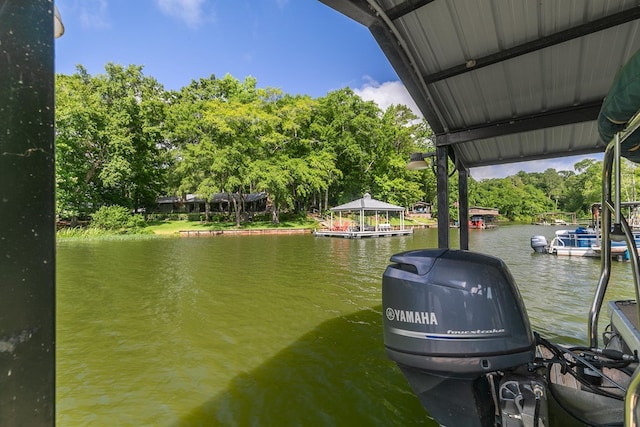 668 Lake Front Dr, Abbeville, AL 36310 - dock area featuring a water view and view of wooded area