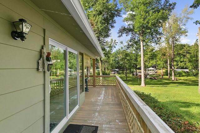 668 Lake Front Dr, Abbeville, AL 36310 - wooden terrace with a yard and view of scattered trees