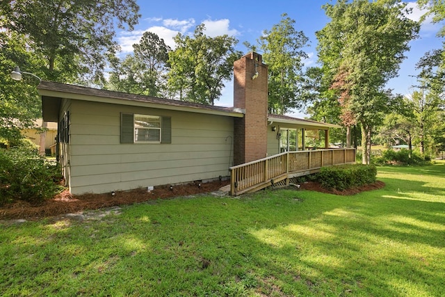 668 Lake Front Dr, Abbeville, AL 36310 - rear view of house with a lawn and a chimney
