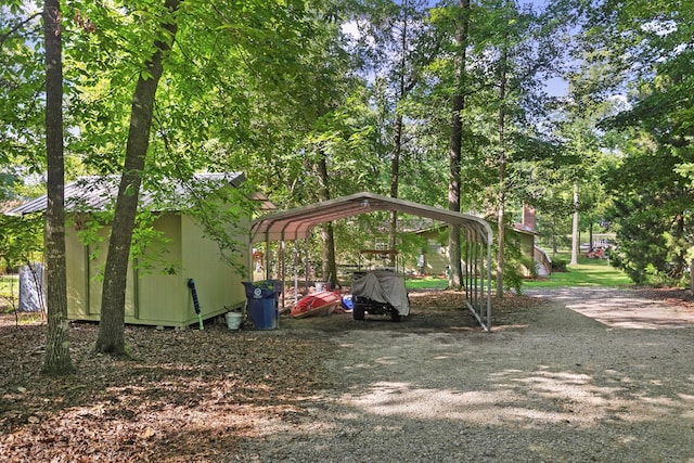 668 Lake Front Dr, Abbeville, AL 36310 - view of yard with a detached carport and dirt driveway