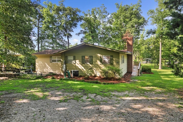 668 Lake Front Dr, Abbeville, AL 36310 - view of front facade with a chimney