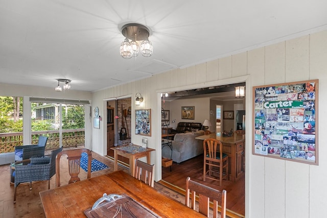 668 Lake Front Dr, Abbeville, AL 36310 - dining space with a chandelier and wood finished floors
