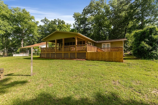 668 Lake Front Dr, Abbeville, AL 36310 - rear view of property with a lawn, a ceiling fan, and a deck