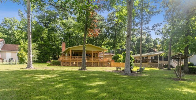 668 Lake Front Dr, Abbeville, AL 36310 - view of yard with a wooden deck and view of scattered trees