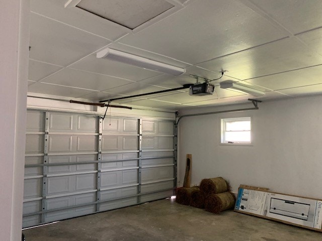 garage featuring a garage door opener