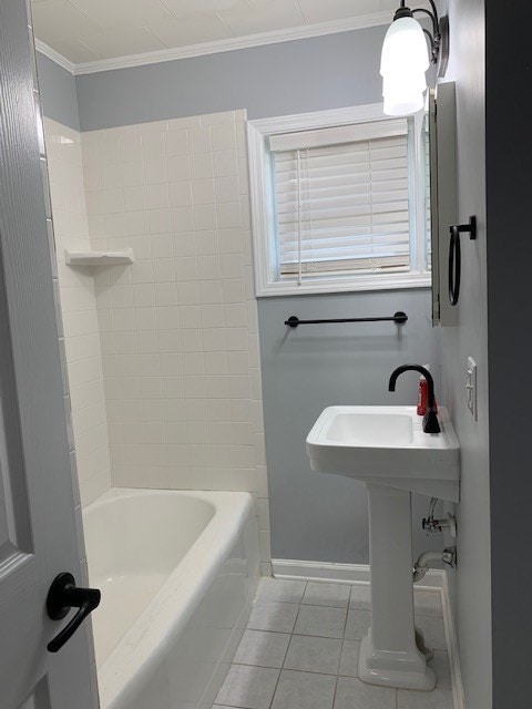 bathroom featuring ornamental molding, tile patterned flooring, and tub / shower combination