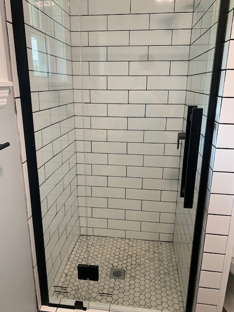 bathroom with an enclosed shower