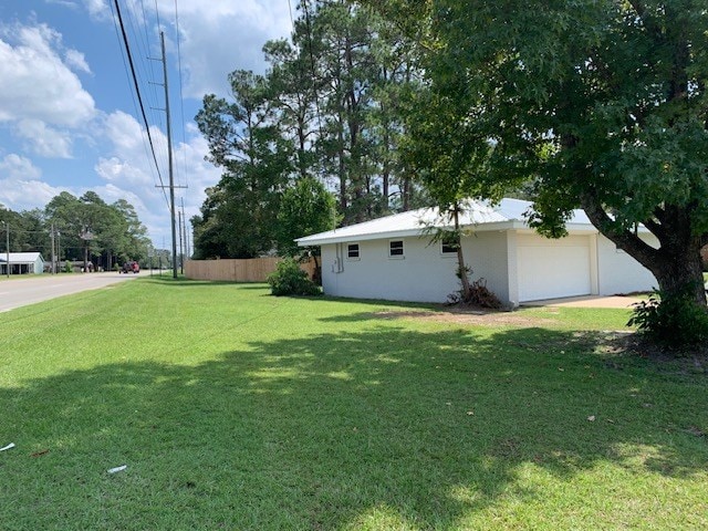 view of yard with a garage