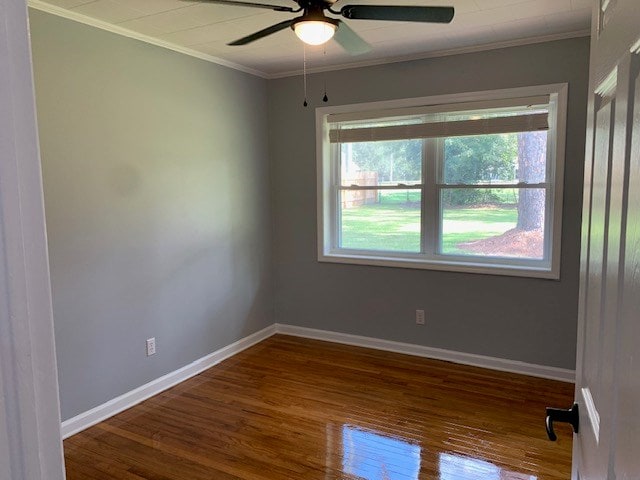 unfurnished room with hardwood / wood-style floors, ceiling fan, and ornamental molding