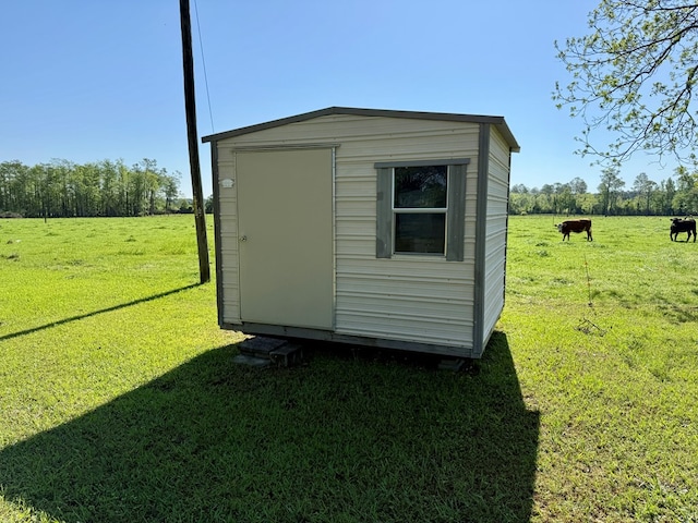 view of shed featuring a rural view