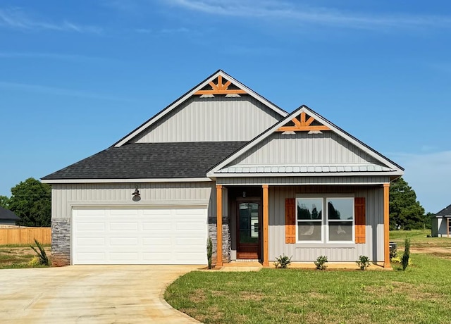 32 Woodham Rd, Ashford, AL 36312 - view of front of home with driveway, a garage, roof with shingles, and stone siding