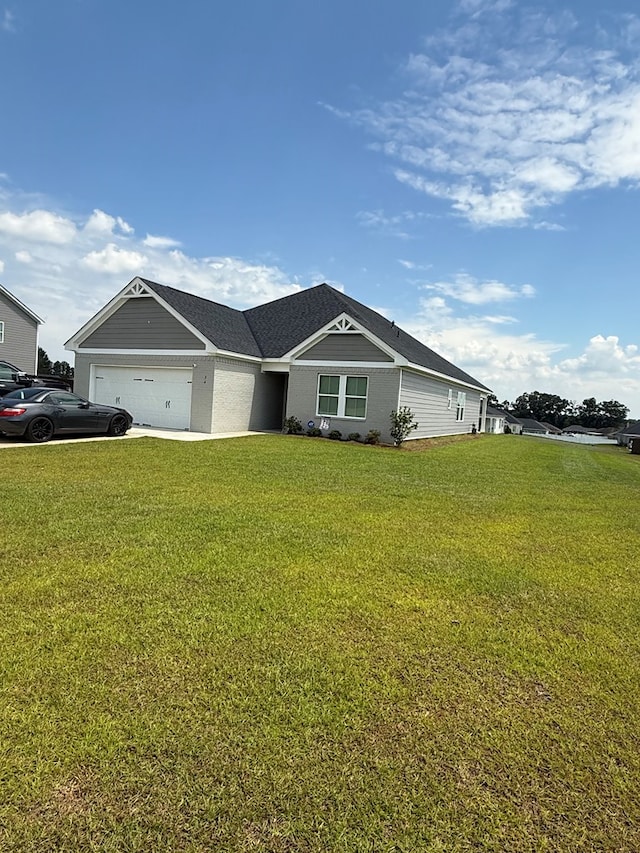 34 Popcorn Cir, Rehobeth, AL 36301 - view of front facade featuring a garage, a front lawn, and concrete driveway