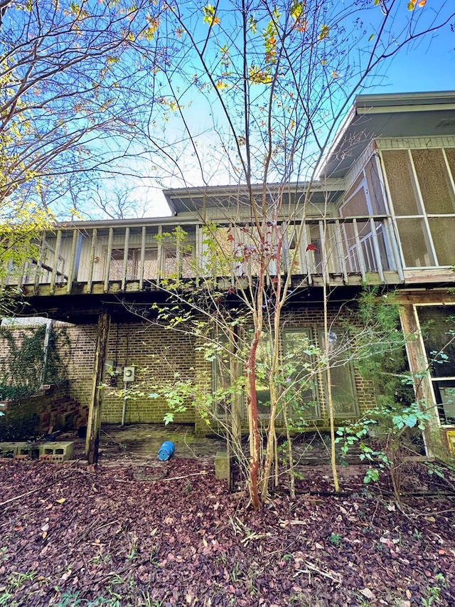 exterior space featuring a sunroom