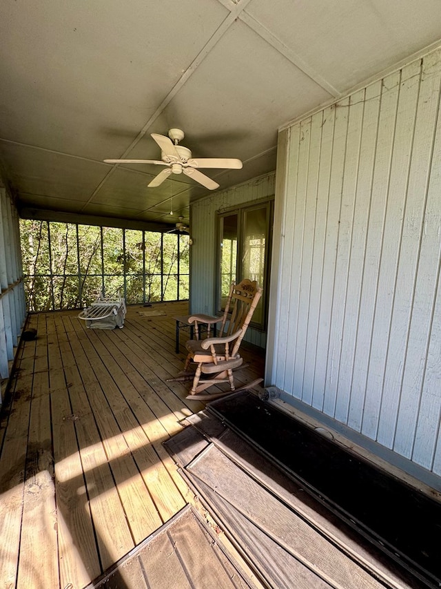 deck featuring ceiling fan and a porch