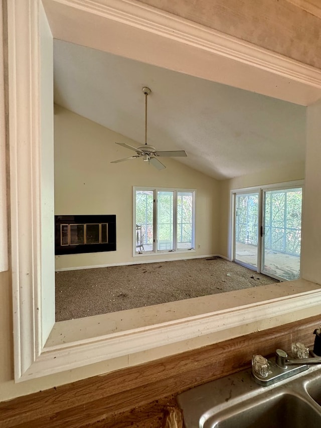 interior details featuring ceiling fan and sink