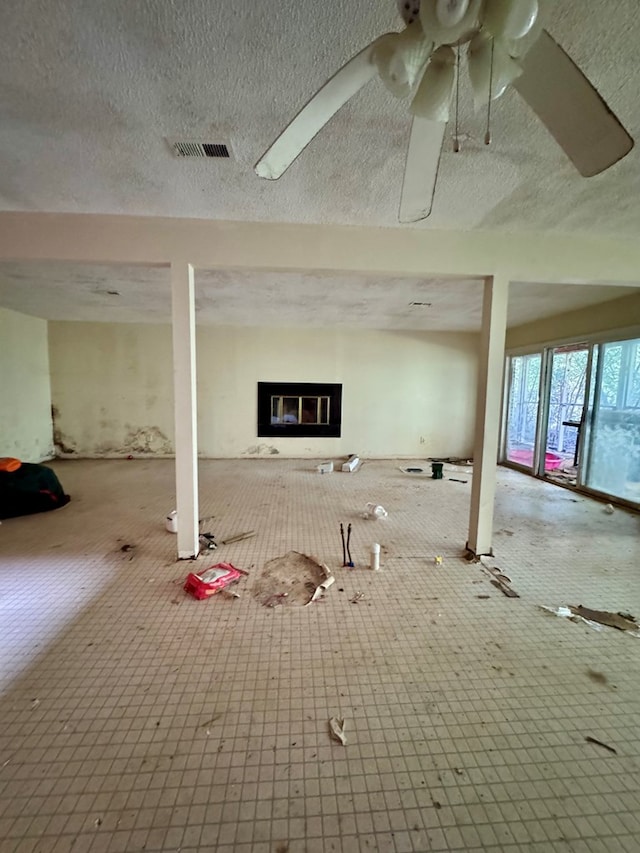 basement featuring a textured ceiling