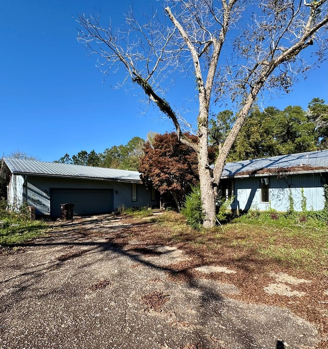 view of side of property with a garage