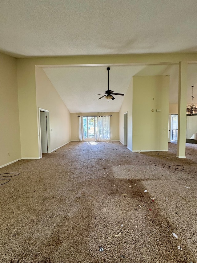 unfurnished living room featuring ceiling fan, carpet floors, a textured ceiling, and vaulted ceiling