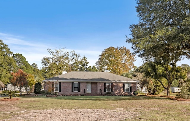 ranch-style home featuring a front yard