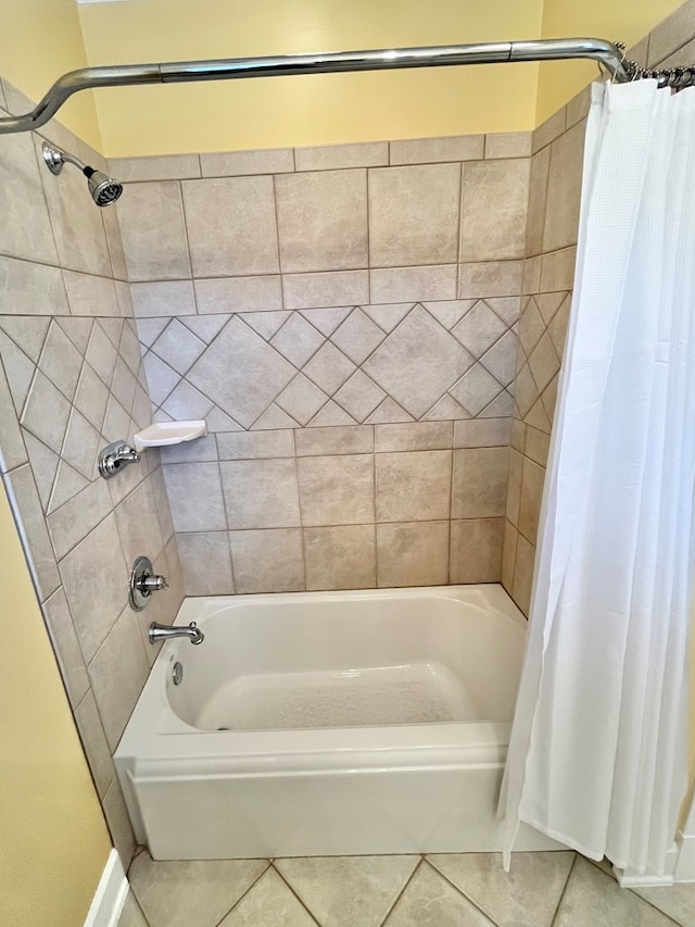 full bathroom featuring tile patterned flooring and shower / bath combo with shower curtain