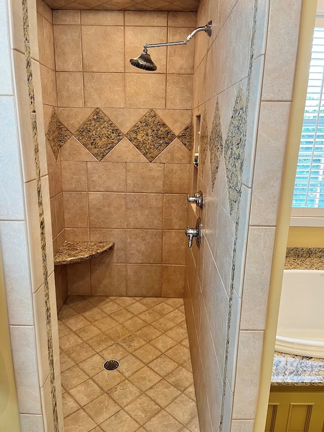 bathroom featuring tiled shower