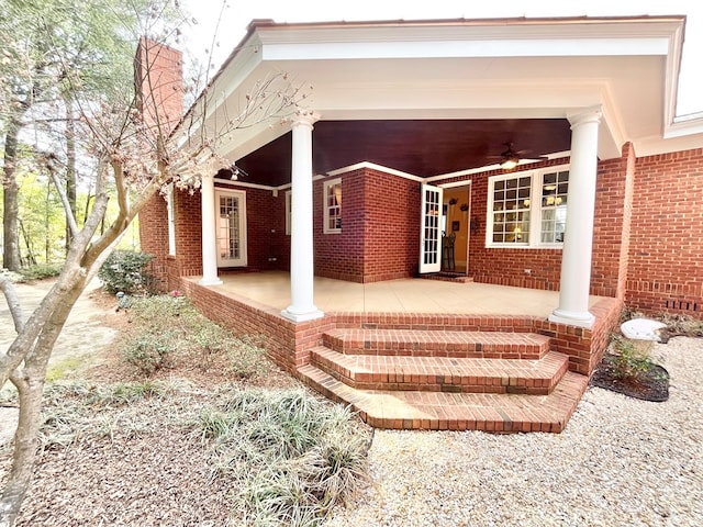 rear view of property featuring brick siding