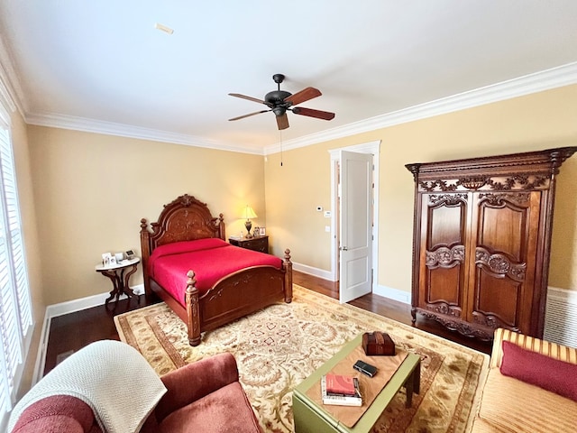 bedroom featuring a ceiling fan, crown molding, baseboards, and wood finished floors